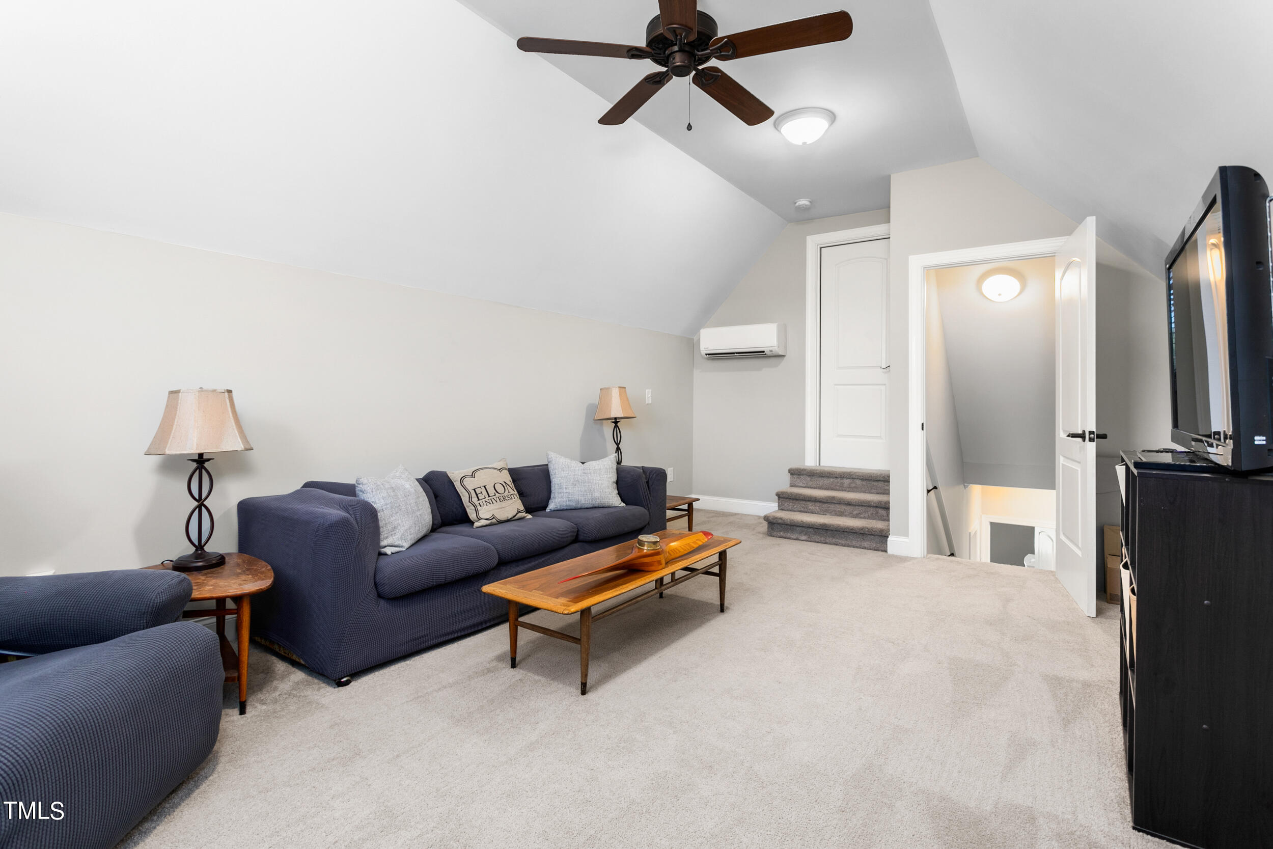 4455 Boyd Wright Road Burlington, NC 27215 - Photo 32 of 40 a living room with furniture and a flat screen tv
