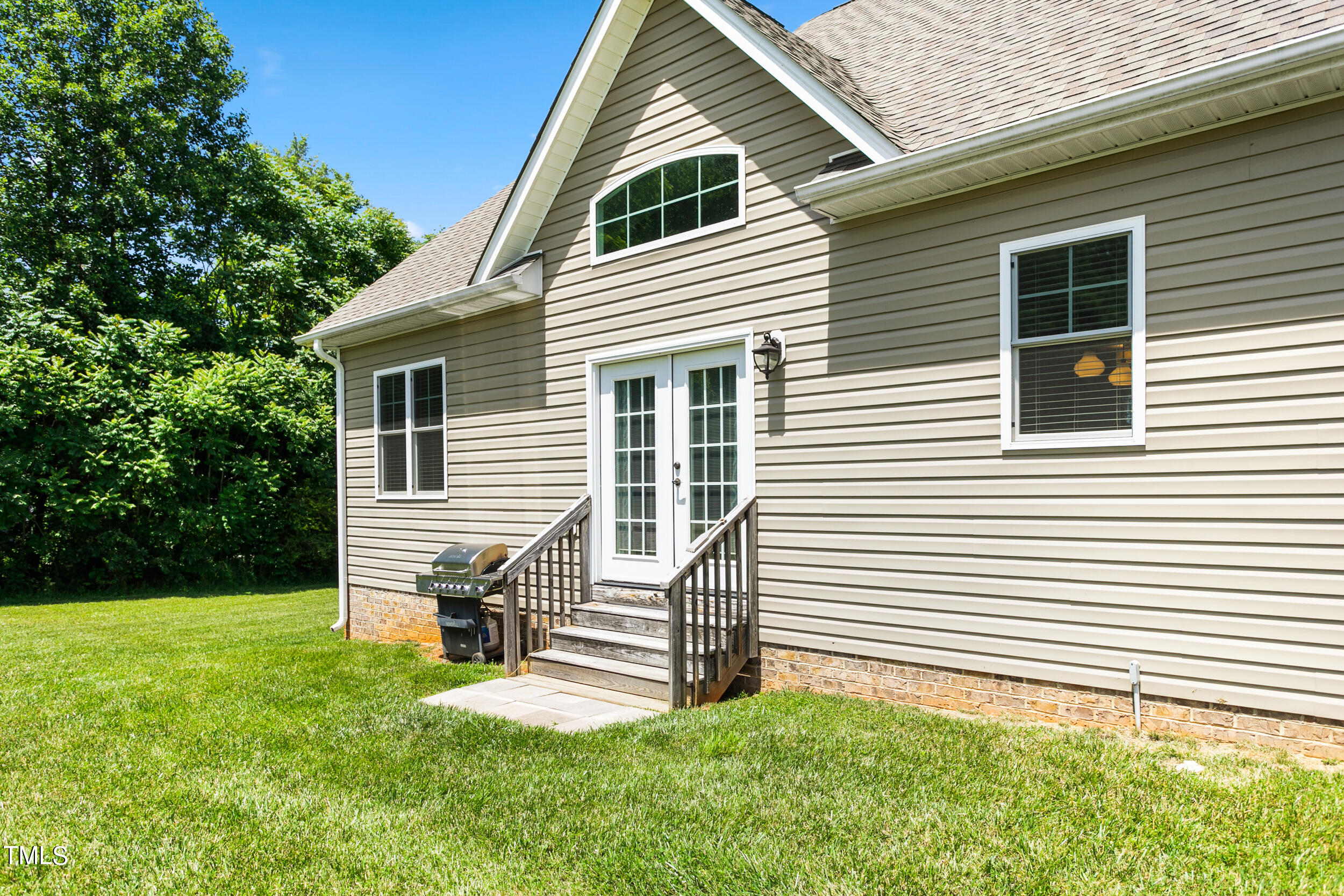 4455 Boyd Wright Road Burlington, NC 27215 - Photo 35 of 40 a view of a house with a yard and a porch