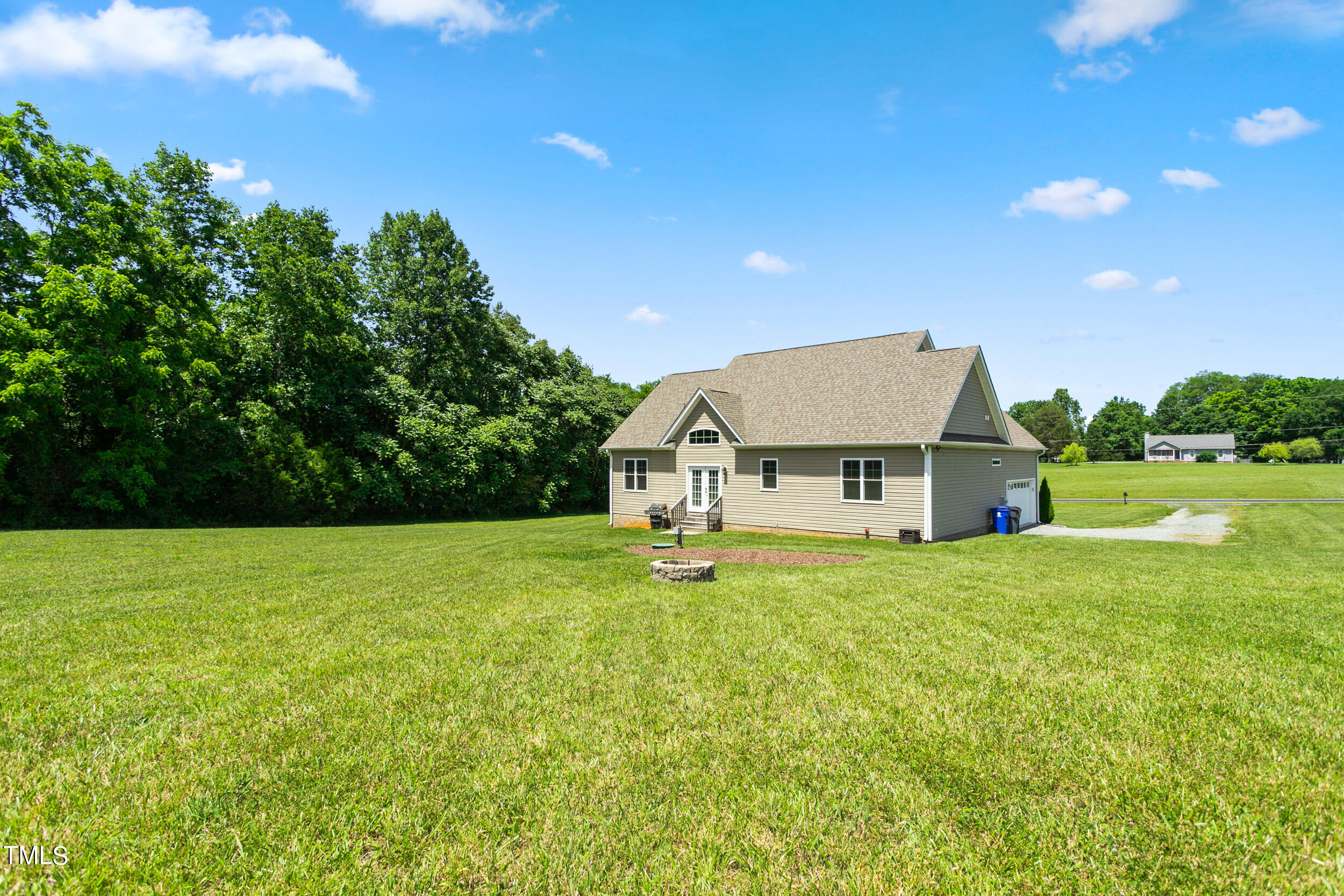 4455 Boyd Wright Road Burlington, NC 27215 - Photo 37 of 40 a house with green field in front of it