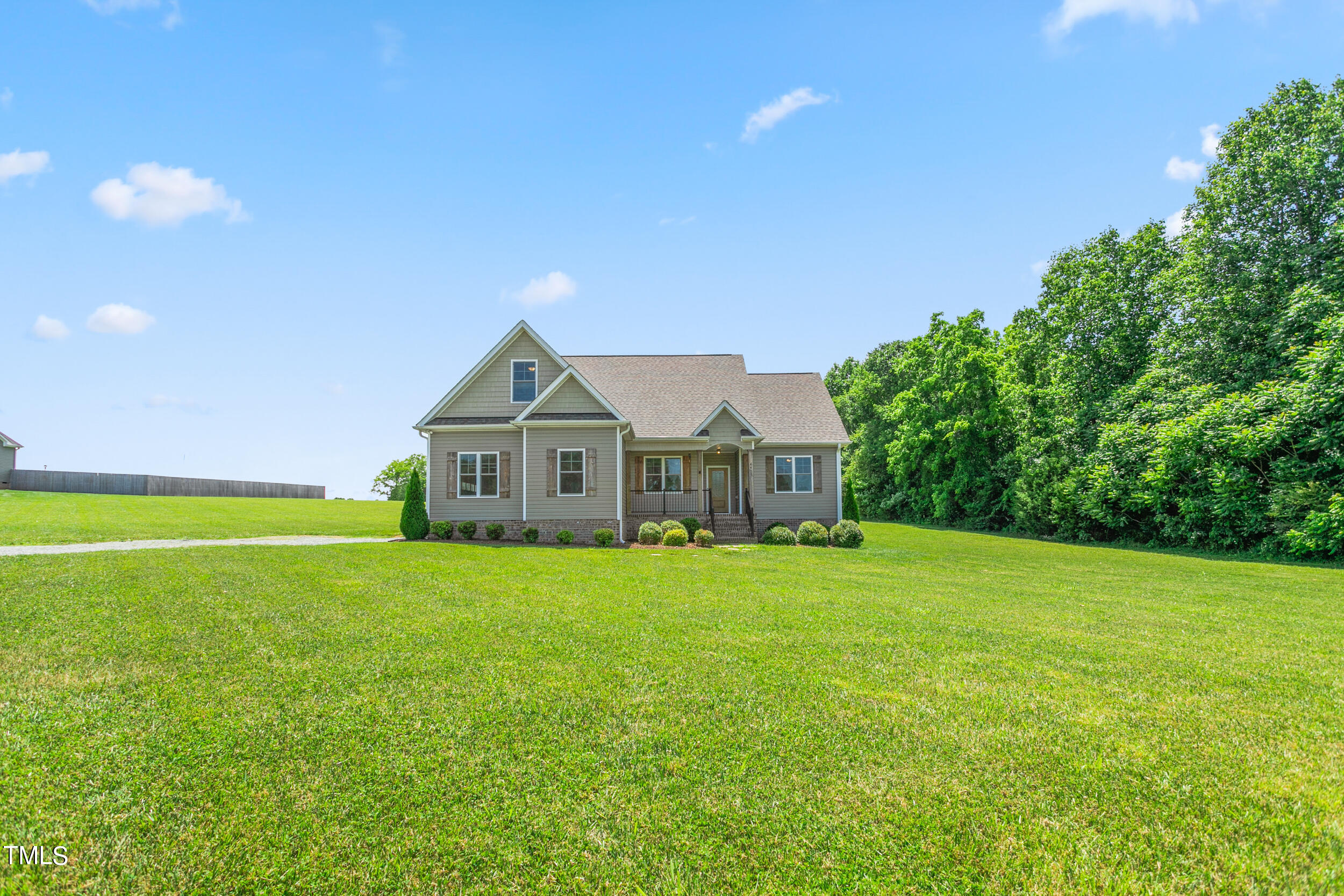 4455 Boyd Wright Road Burlington, NC 27215 - Photo 4 of 40 a front view of a house with yard and green space