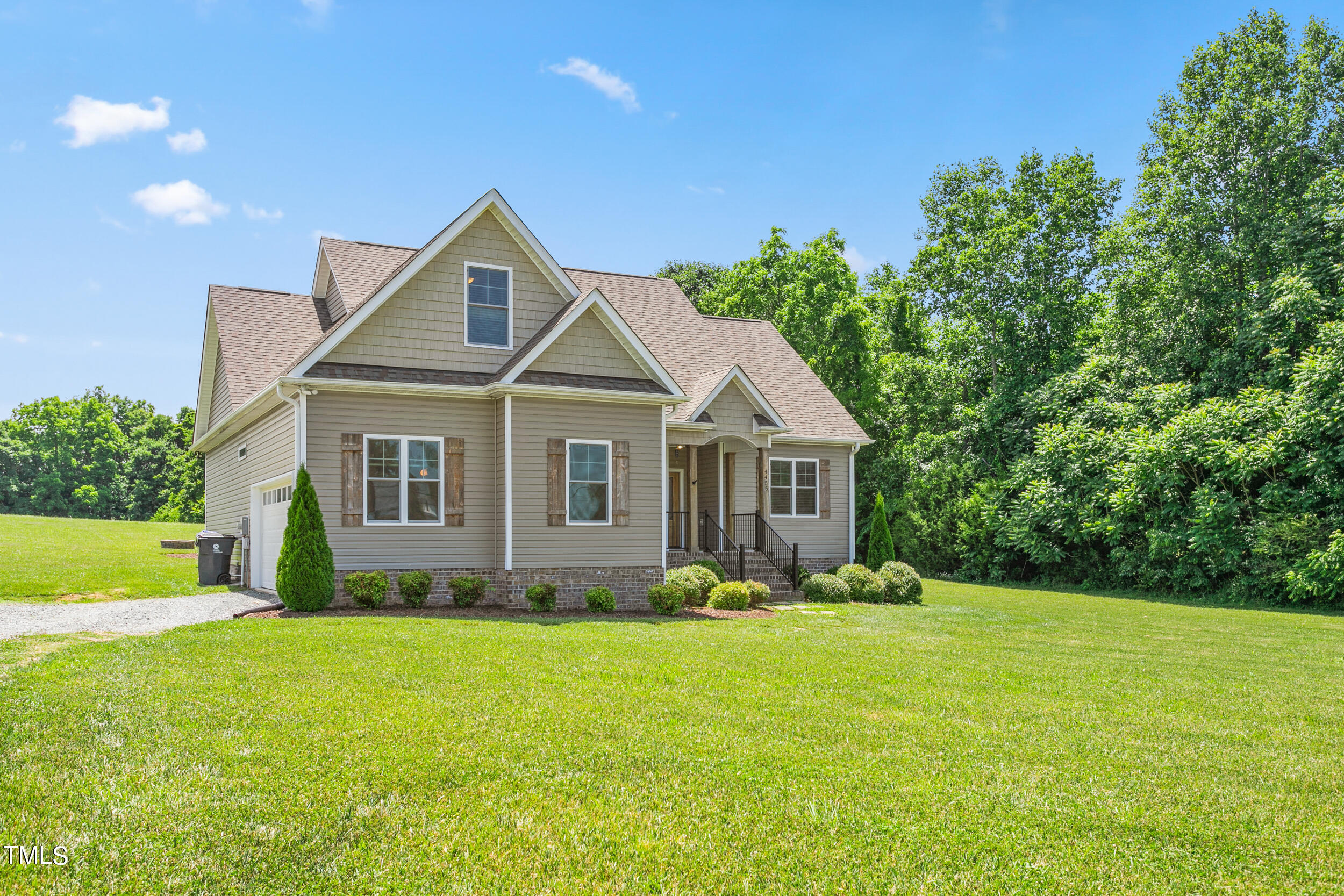 4455 Boyd Wright Road Burlington, NC 27215 - Photo 5 of 40 a front view of a house with garden