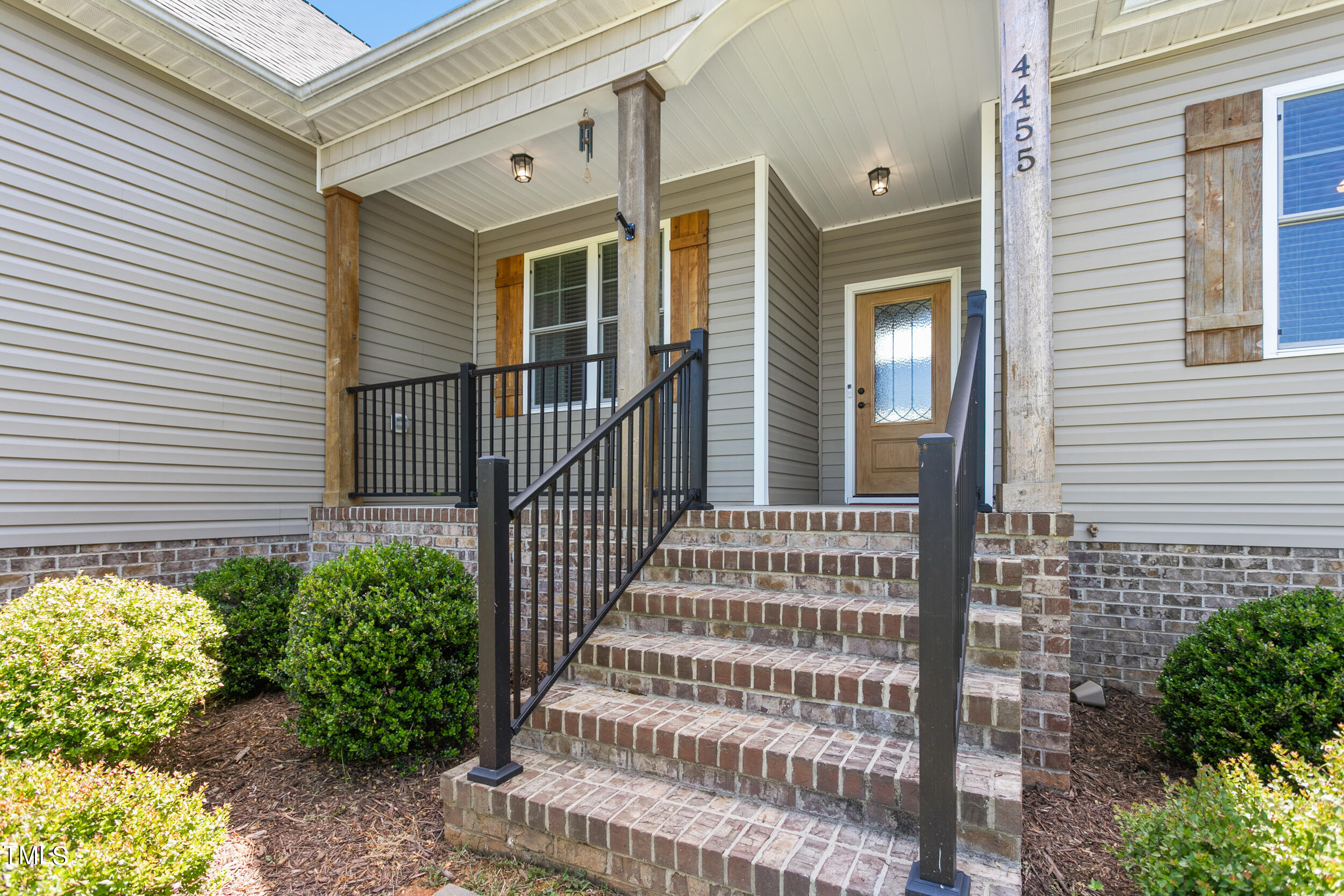 4455 Boyd Wright Road Burlington, NC 27215 - Photo 7 of 40 a front view of a house with a garden