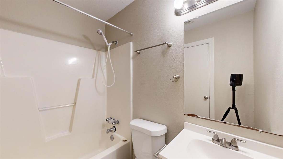 500 Foch Street, Unit 7 Bryan, TX 77801 - Photo 8 of 11 a bathroom with a sink toilet and shower