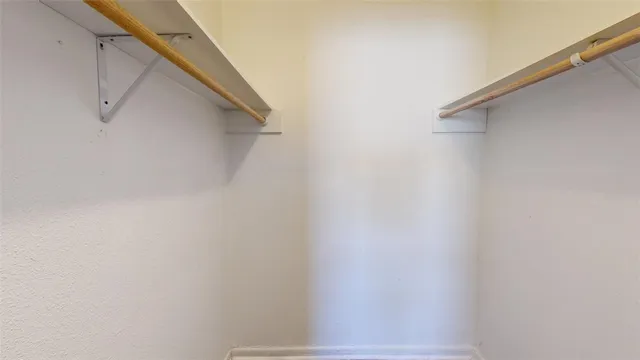 a view of a house with a tree next to a yard