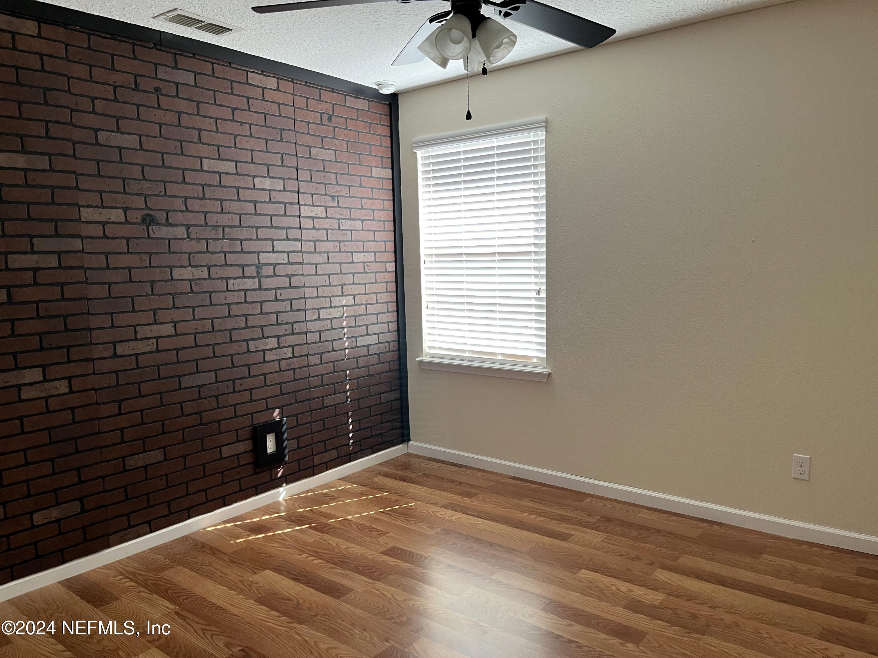 294 Buck Run Way St. Augustine, FL 32092 - Photo 12 of 22 a view of an empty room with a window
