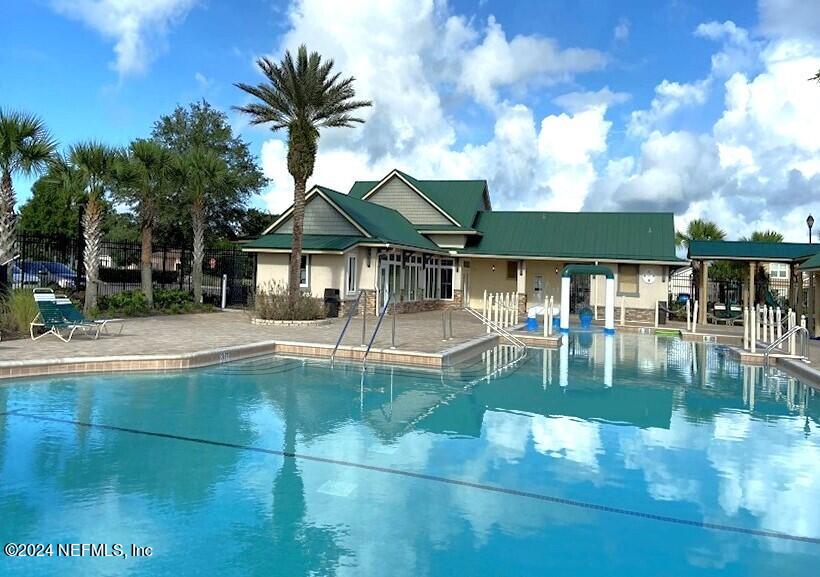 294 Buck Run Way St. Augustine, FL 32092 - Photo 21 of 22 a swimming pool with outdoor seating