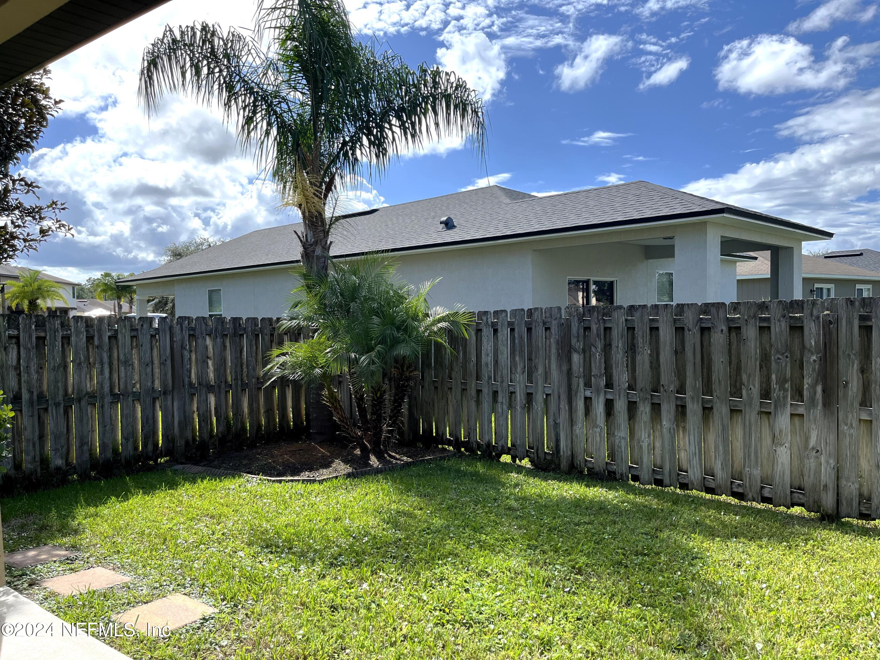 294 Buck Run Way St. Augustine, FL 32092 - Photo 8 of 22 a house view with a garden space