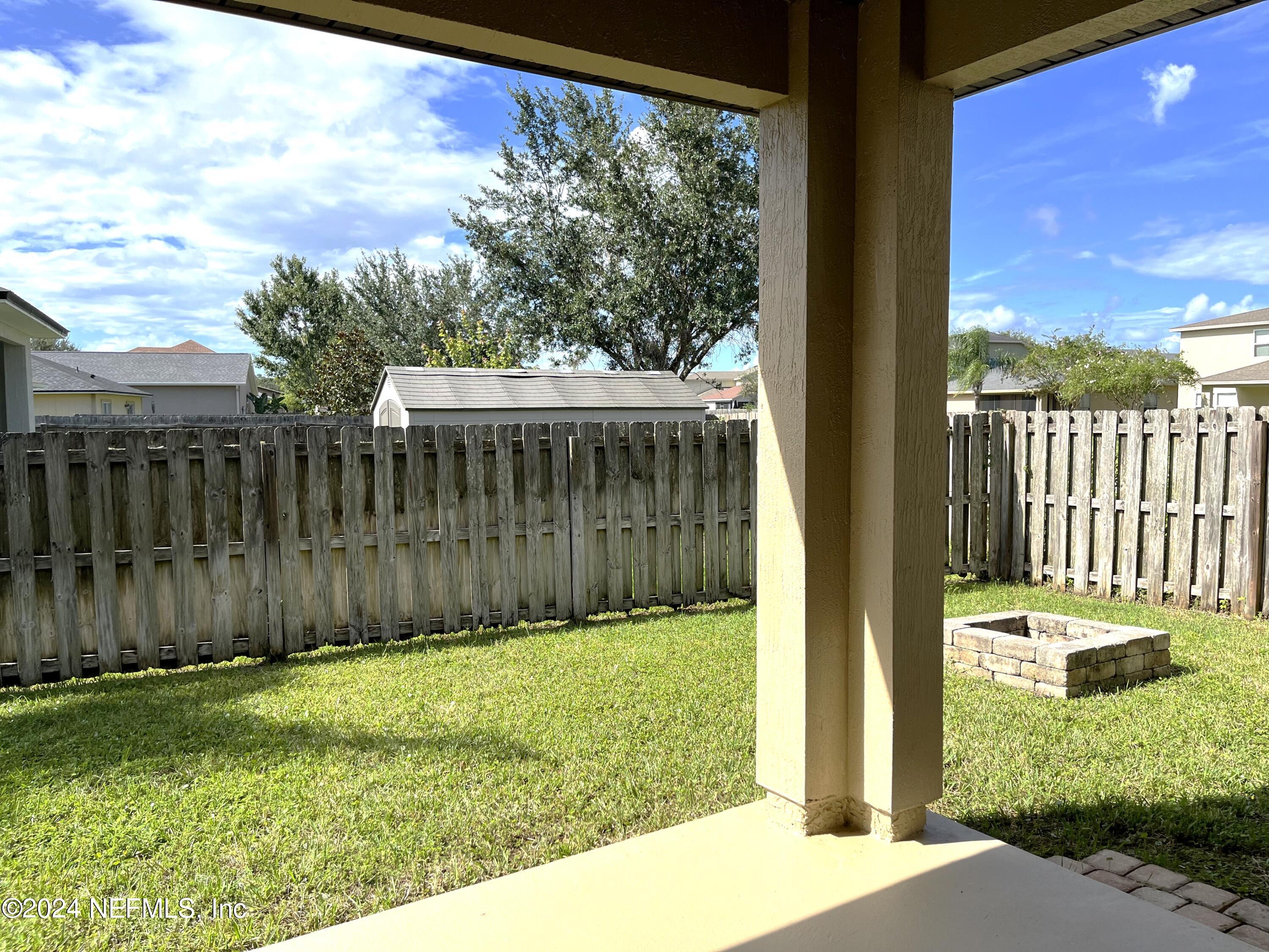 294 Buck Run Way St. Augustine, FL 32092 - Photo 9 of 22 a view of a backyard with a garden