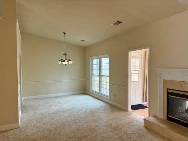 a view of livingroom with window fireplace