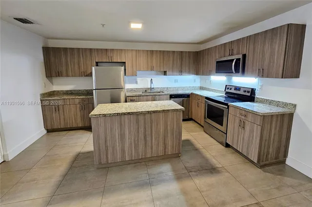 a close view of a stove a microwave and oven