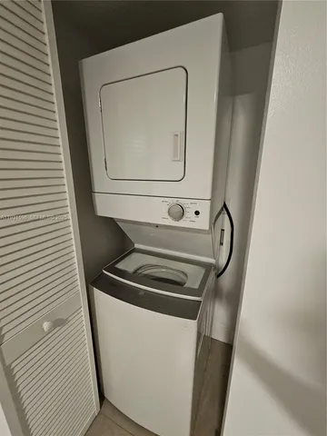 a kitchen with a sink cabinets and utility