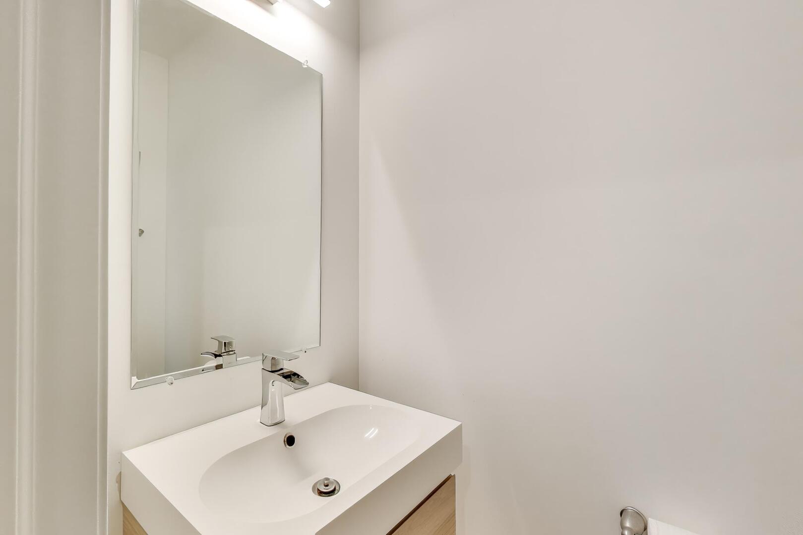 3625 South Morgan Street, Unit C Chicago, IL 60609 - Photo 17 of 44 a bathroom with a sink and a mirror