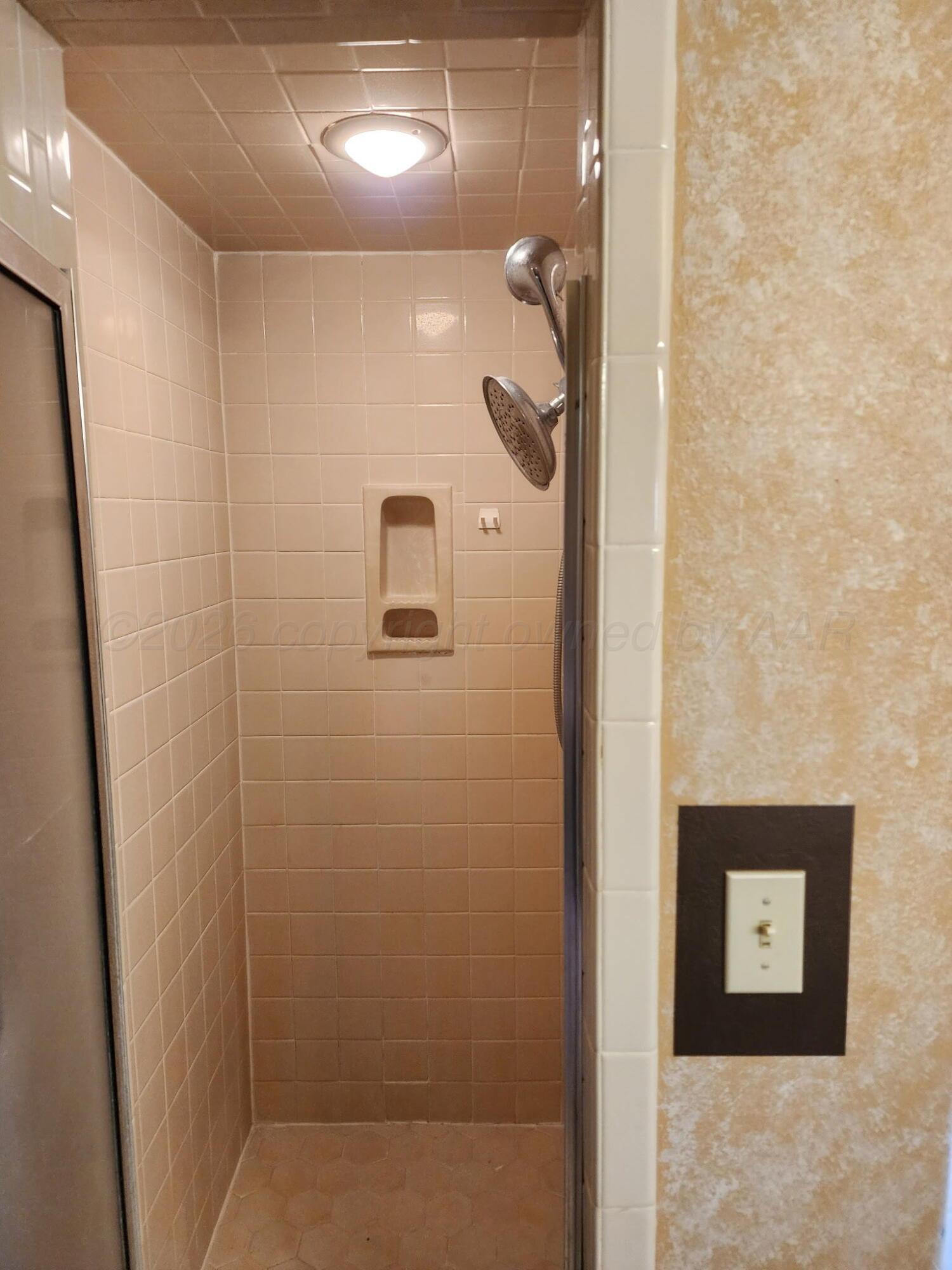 16700 Old Ranch Road Canyon, TX 79015 - Photo 27 of 54 a bathroom with a shower and a sink