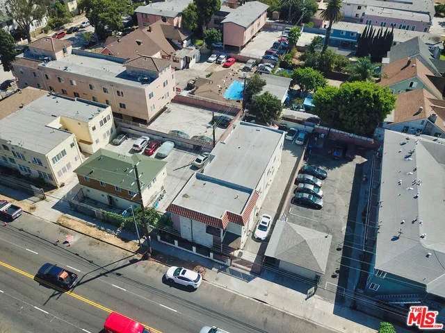 an aerial view of residential house with parking