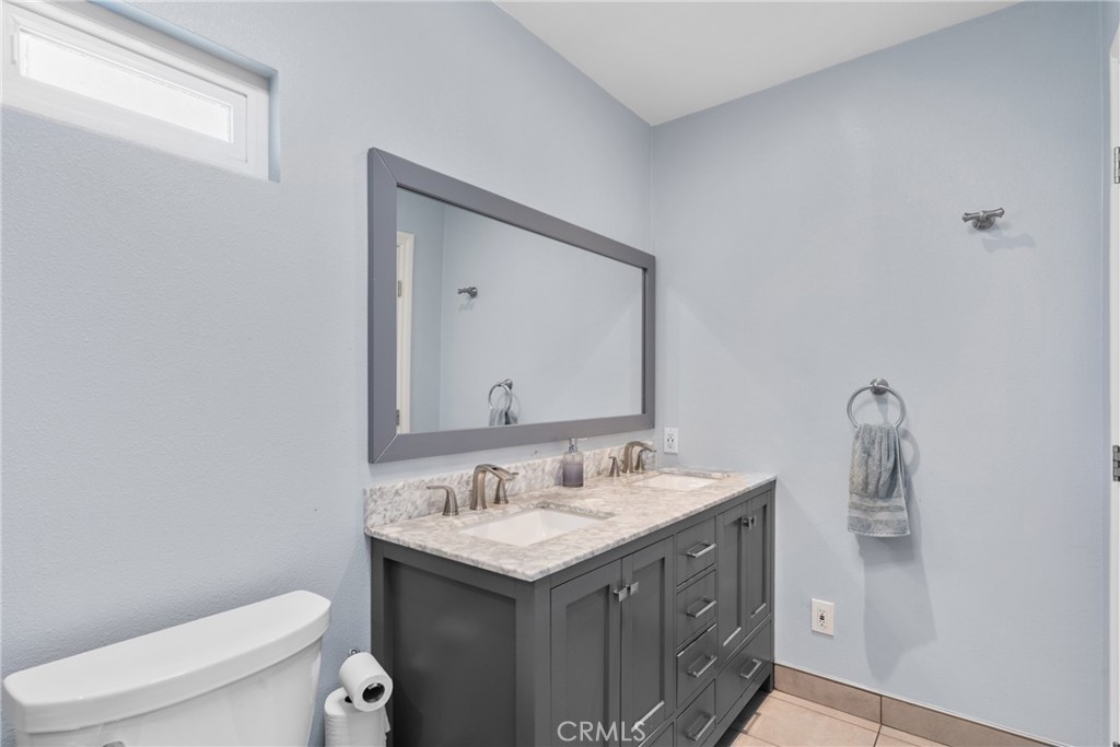609 La Seda Road La Puente, CA 91744 - Photo 19 of 34 a bathroom with a sink and a toilet