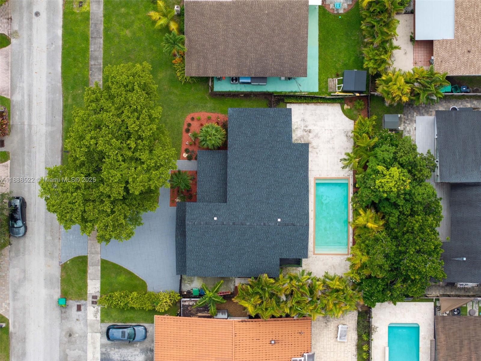 11006 Southwest 138th Place Miami, FL 33186 - Photo 1 of 47 an aerial view of a house with garden space and a lake view