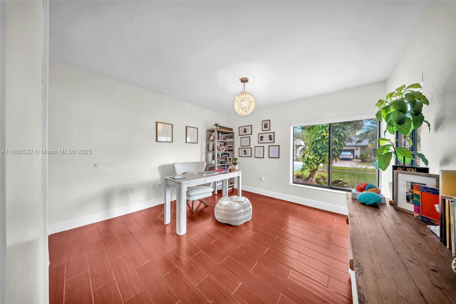 11006 Southwest 138th Place Miami, FL 33186 - Photo 11 of 47 a living room with furniture and a flat screen tv