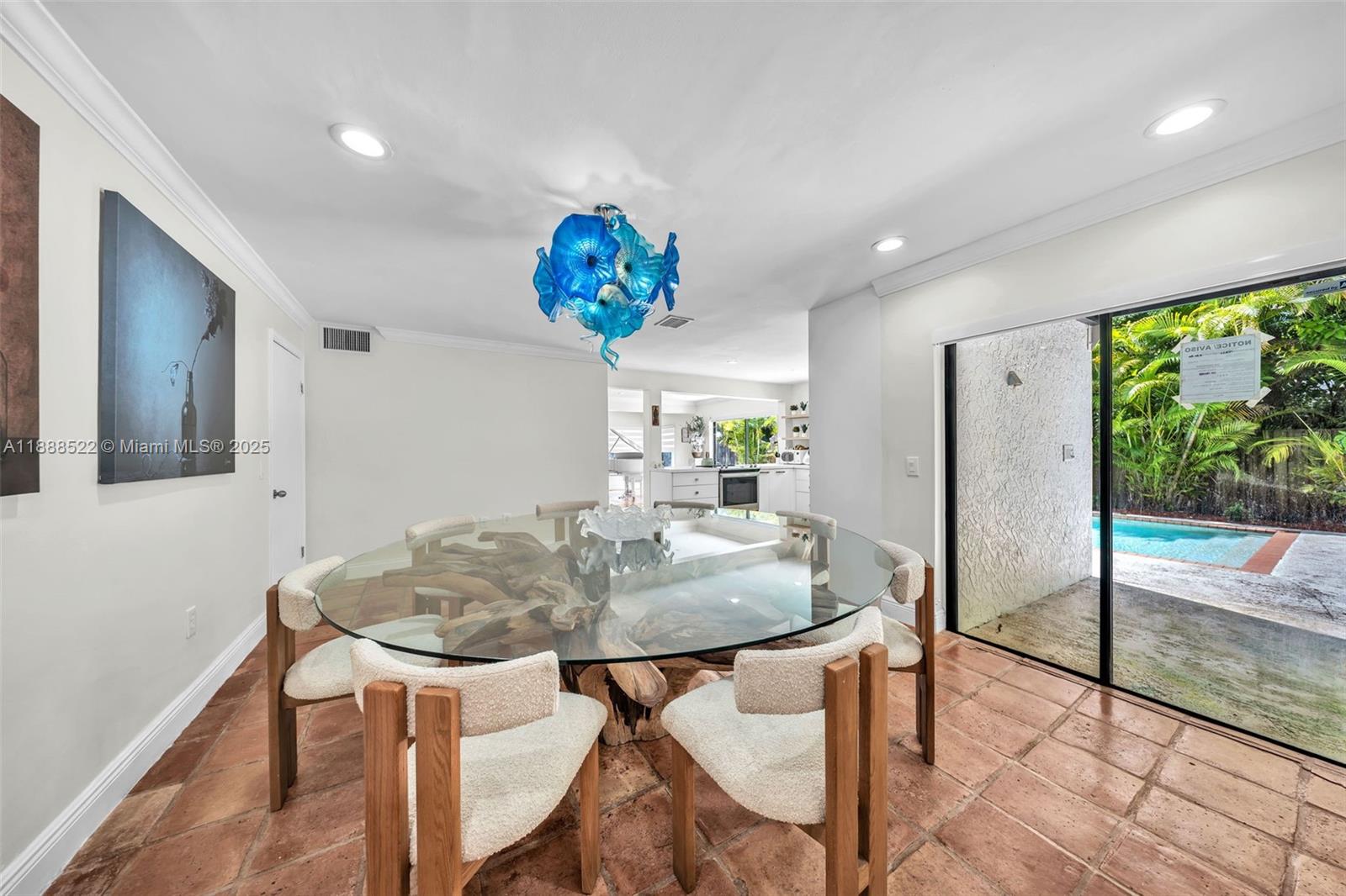 11006 Southwest 138th Place Miami, FL 33186 - Photo 20 of 47 a view of a dining room with furniture and a floor to ceiling window