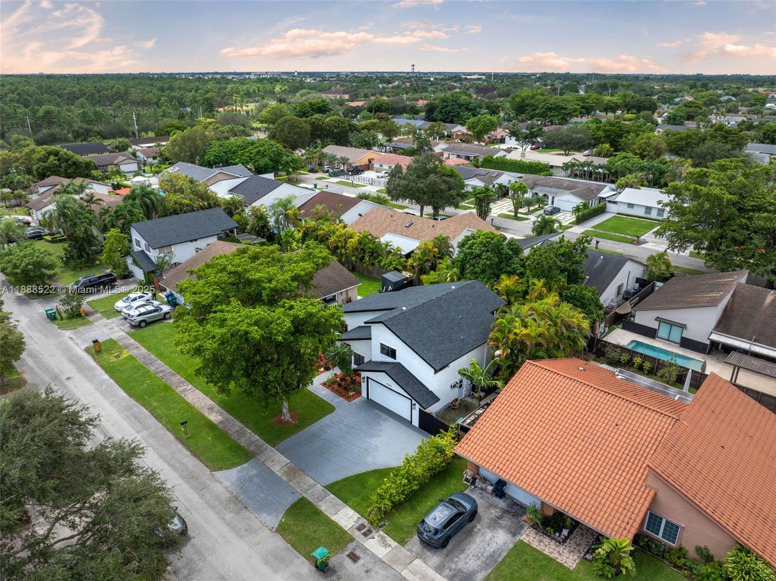 11006 Southwest 138th Place Miami, FL 33186 - Photo 2 of 47 an aerial view of a house with a garden