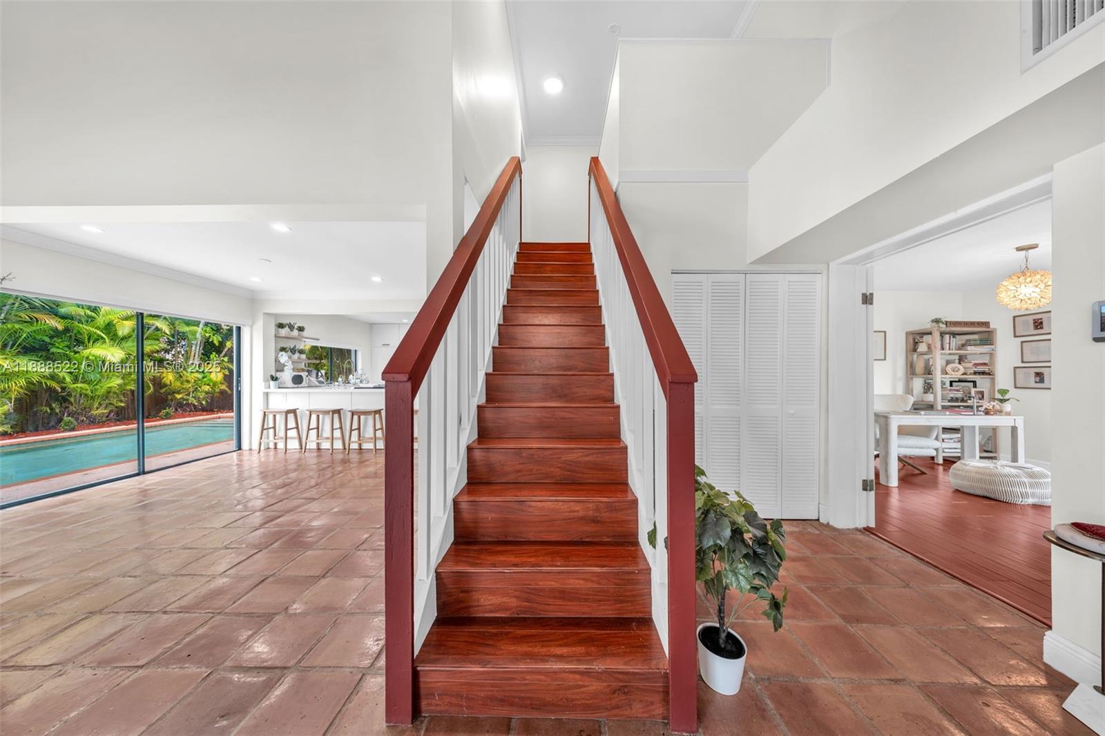 11006 Southwest 138th Place Miami, FL 33186 - Photo 22 of 47 a view of entryway with wooden floor and stairs