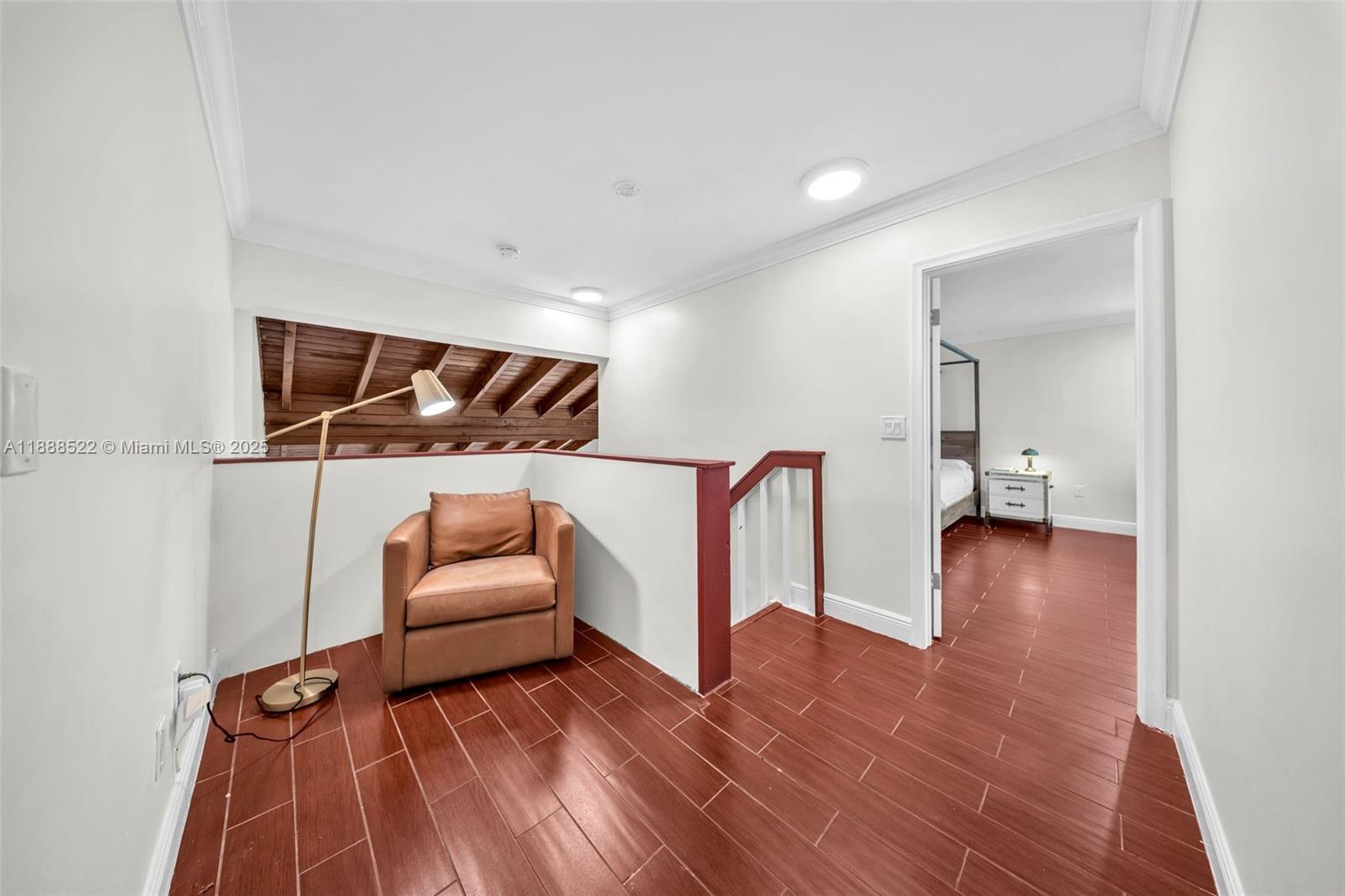 11006 Southwest 138th Place Miami, FL 33186 - Photo 24 of 47 a hallway with furniture and wooden floor