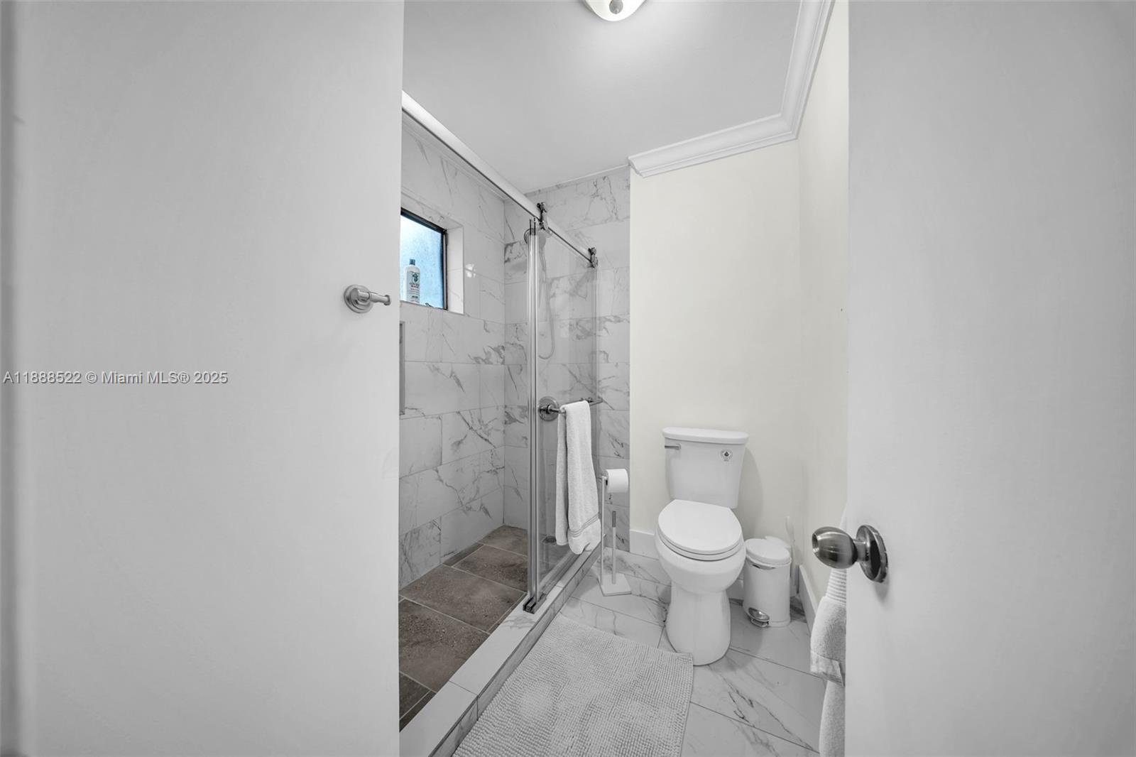 11006 Southwest 138th Place Miami, FL 33186 - Photo 31 of 47 a bathroom with a toilet and a shower