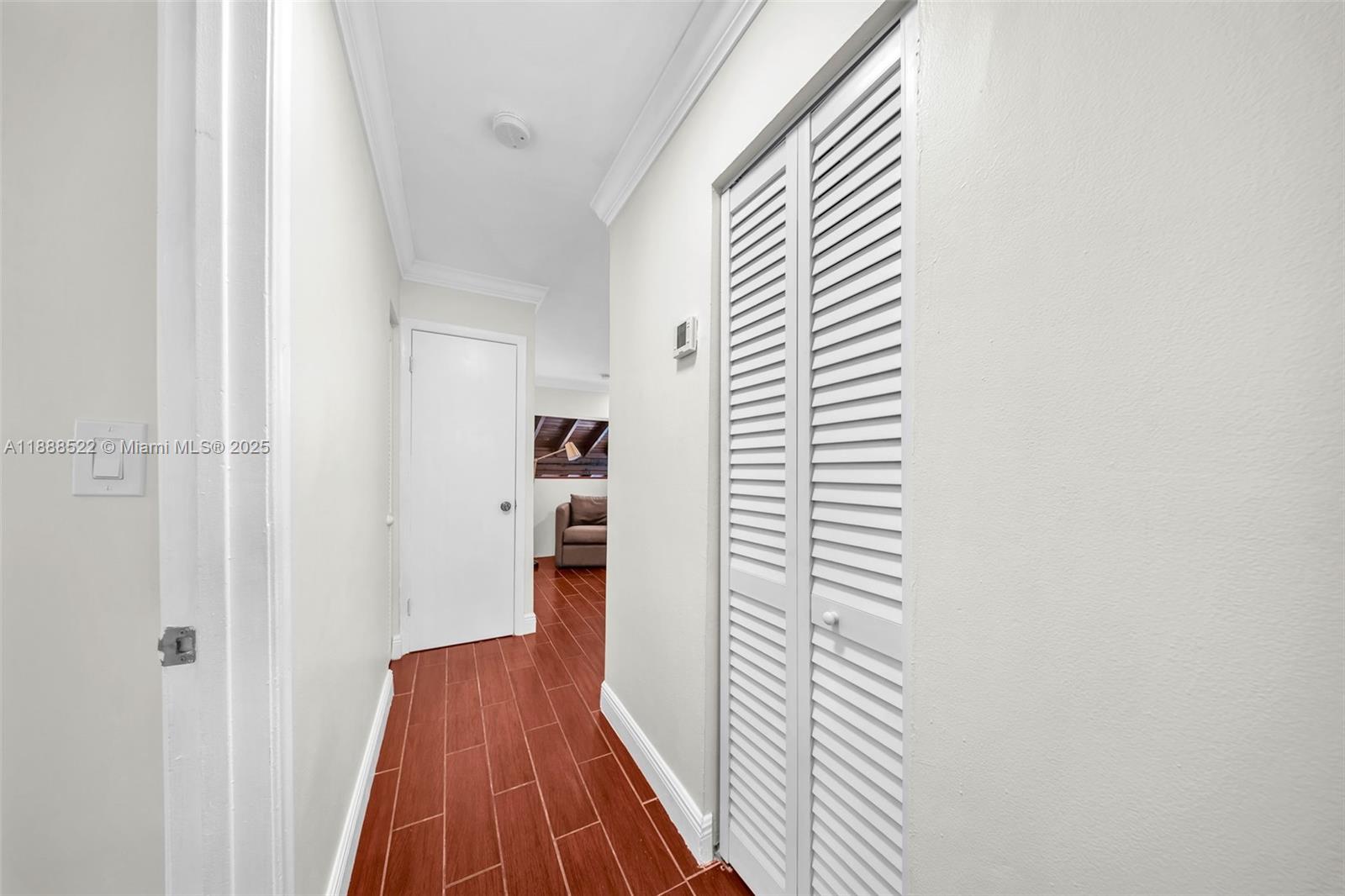 11006 Southwest 138th Place Miami, FL 33186 - Photo 35 of 47 a view of a hallway with wooden floor and closet