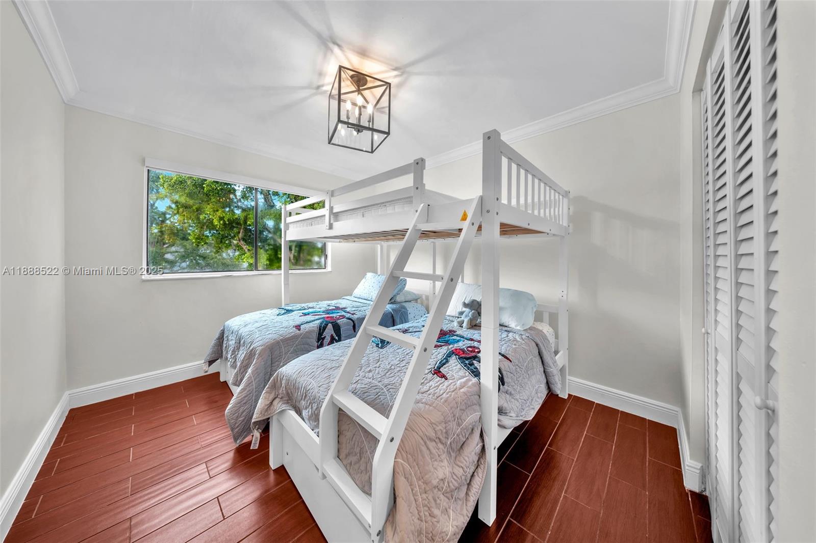 11006 Southwest 138th Place Miami, FL 33186 - Photo 36 of 47 a bedroom with bed and a window