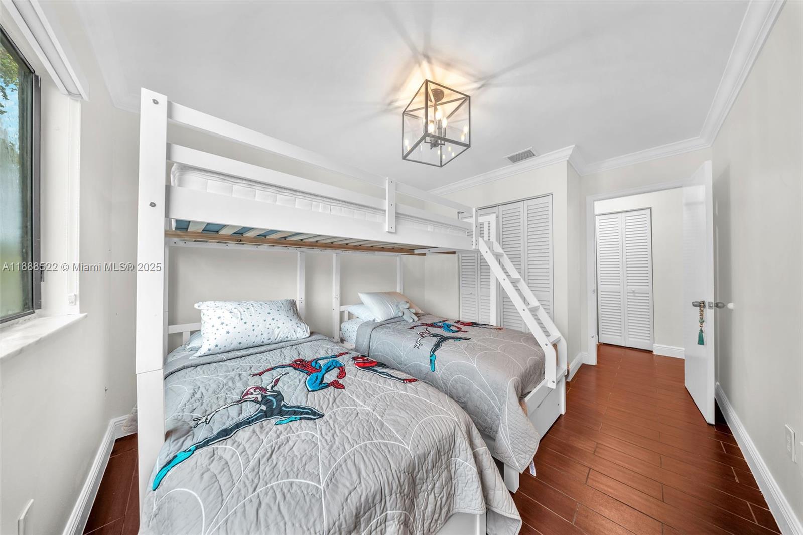 11006 Southwest 138th Place Miami, FL 33186 - Photo 37 of 47 a bed room with a bed and a window