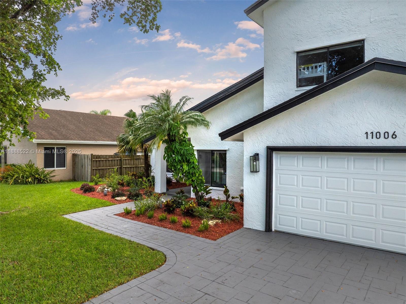 11006 Southwest 138th Place Miami, FL 33186 - Photo 4 of 47 a view of a house with backyard and porch