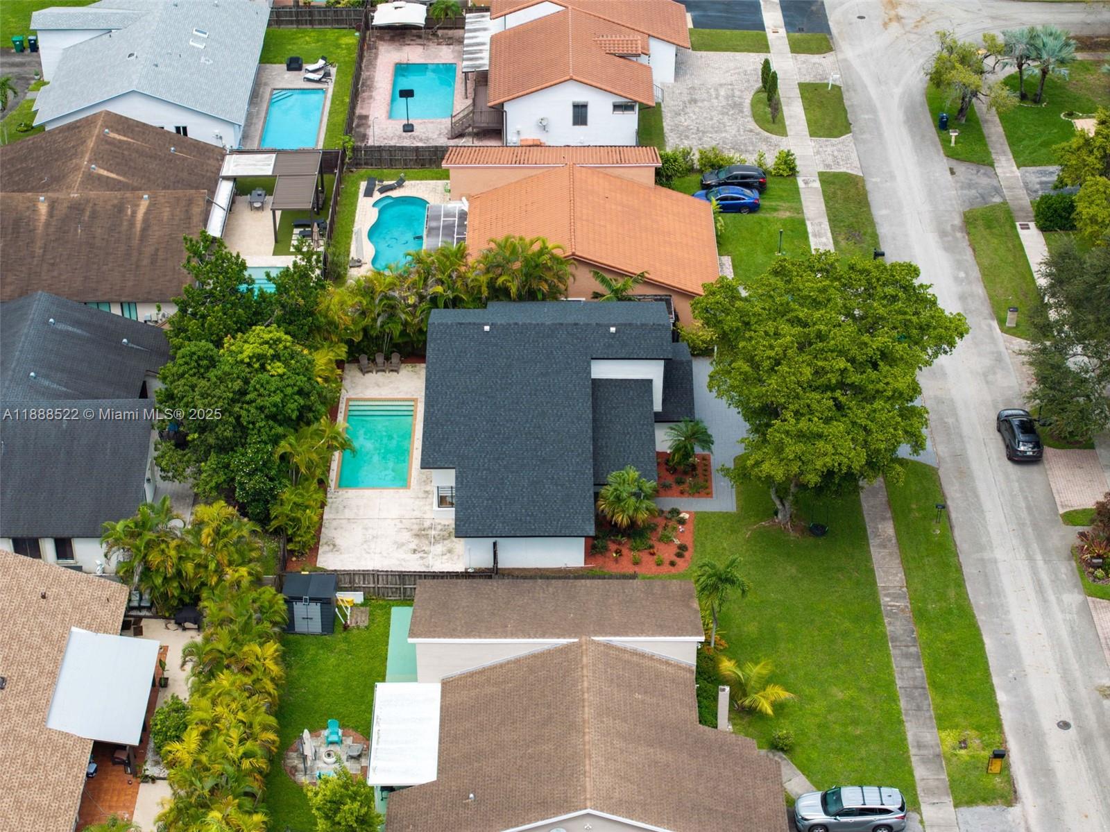 11006 Southwest 138th Place Miami, FL 33186 - Photo 43 of 47 an aerial view of multiple houses with a yard