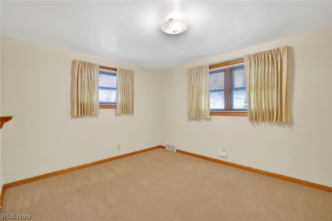 4820 15th Street Northwest Canton, OH 44708 - Photo 14 of 28 Bedroom with carpet and windows