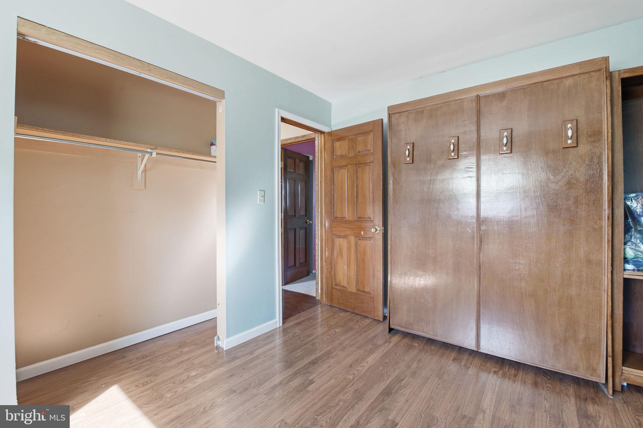 6501 Fair School Road Glen Rock, PA 17327 - Photo 12 of 43 a view of an empty room with wooden floor and a bathroom