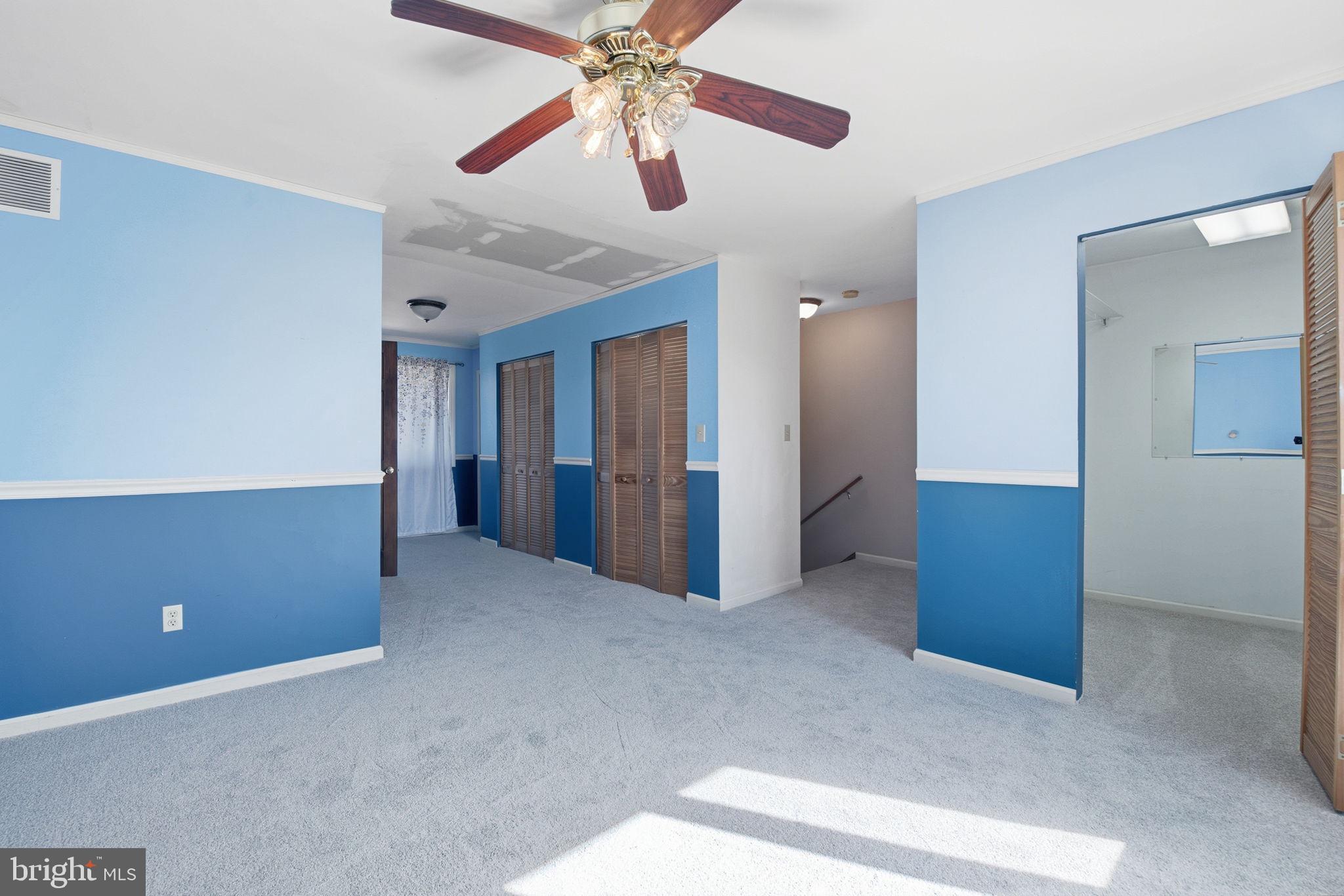 6501 Fair School Road Glen Rock, PA 17327 - Photo 18 of 43 an empty room with closet and fan