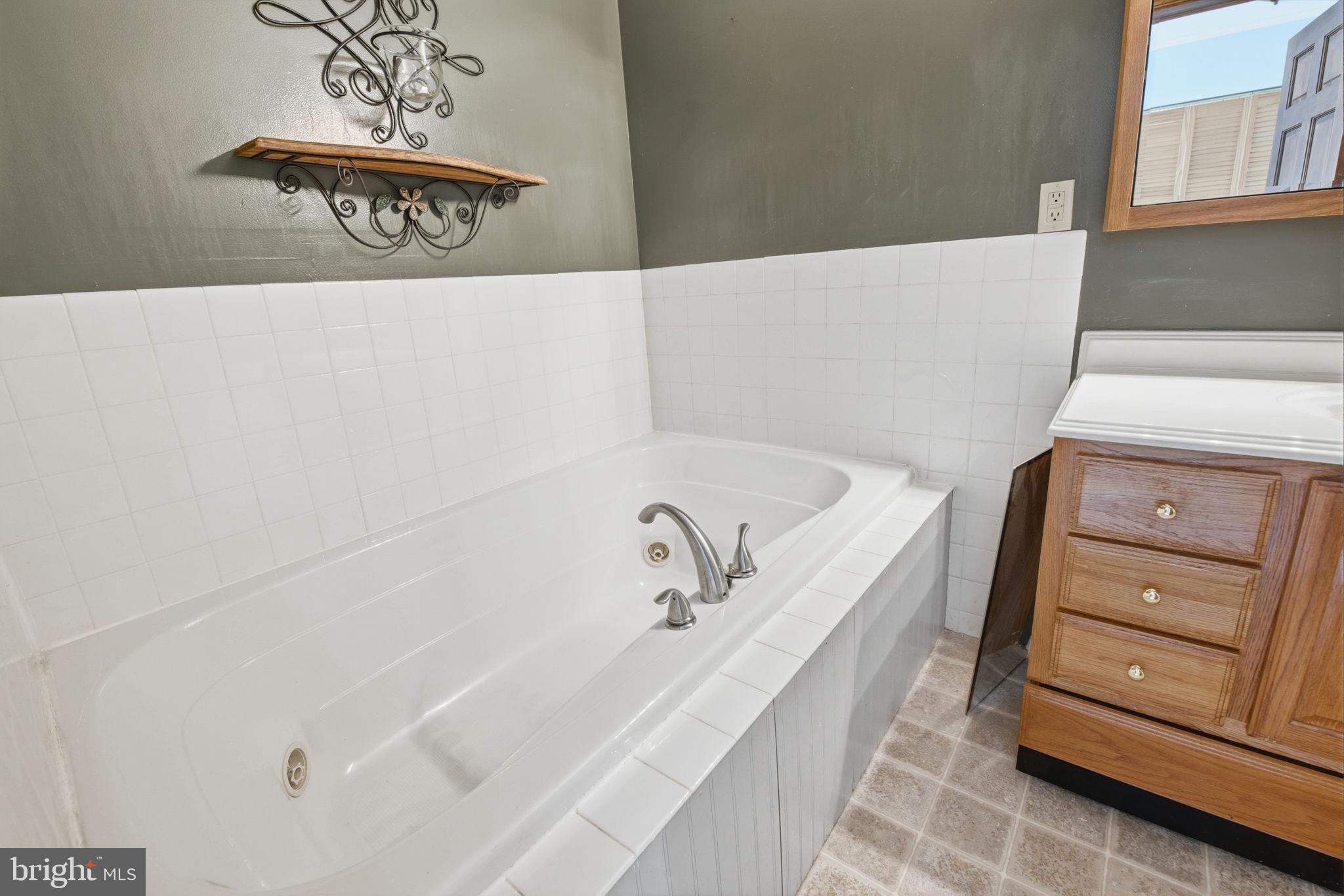 6501 Fair School Road Glen Rock, PA 17327 - Photo 22 of 43 a bathroom with a bathtub and a window