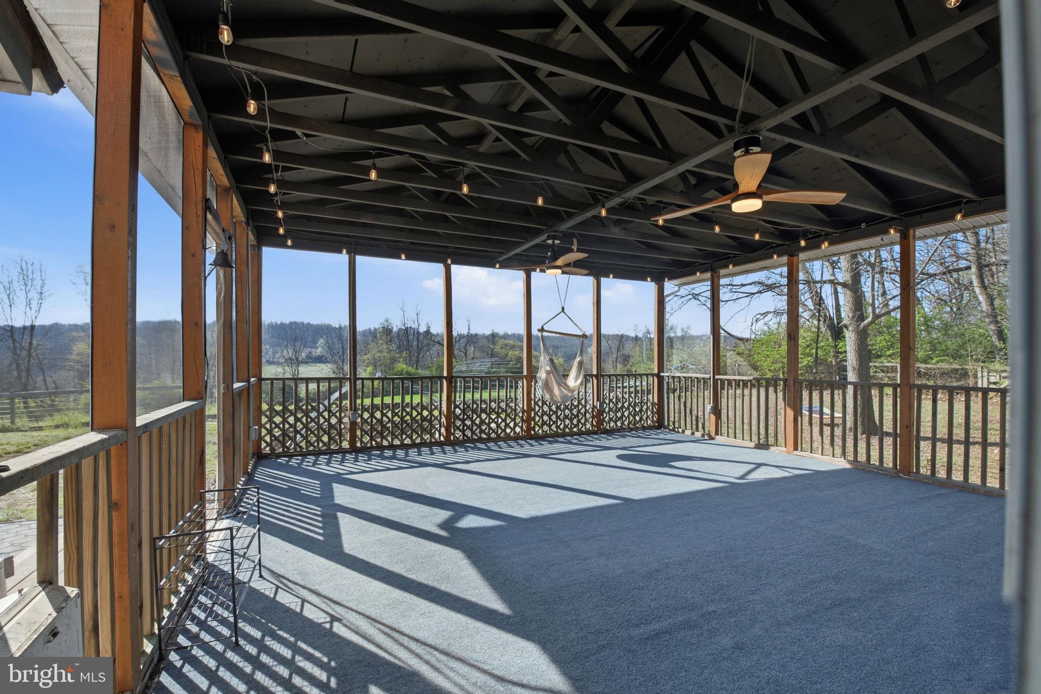 6501 Fair School Road Glen Rock, PA 17327 - Photo 38 of 43 a view of porch with a floor to ceiling window and city view