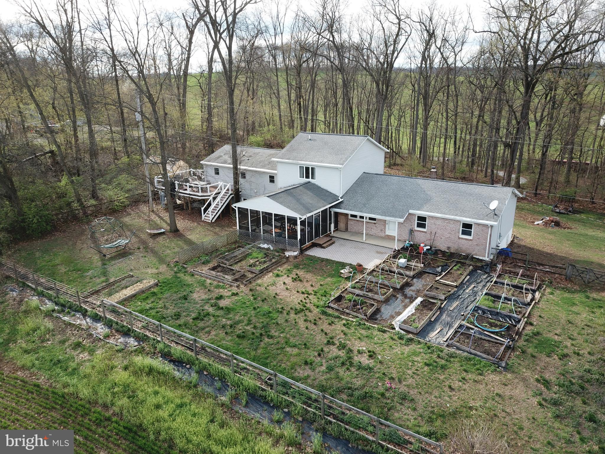 6501 Fair School Road Glen Rock, PA 17327 - Photo 41 of 43 an aerial view of a house with garden space and patio