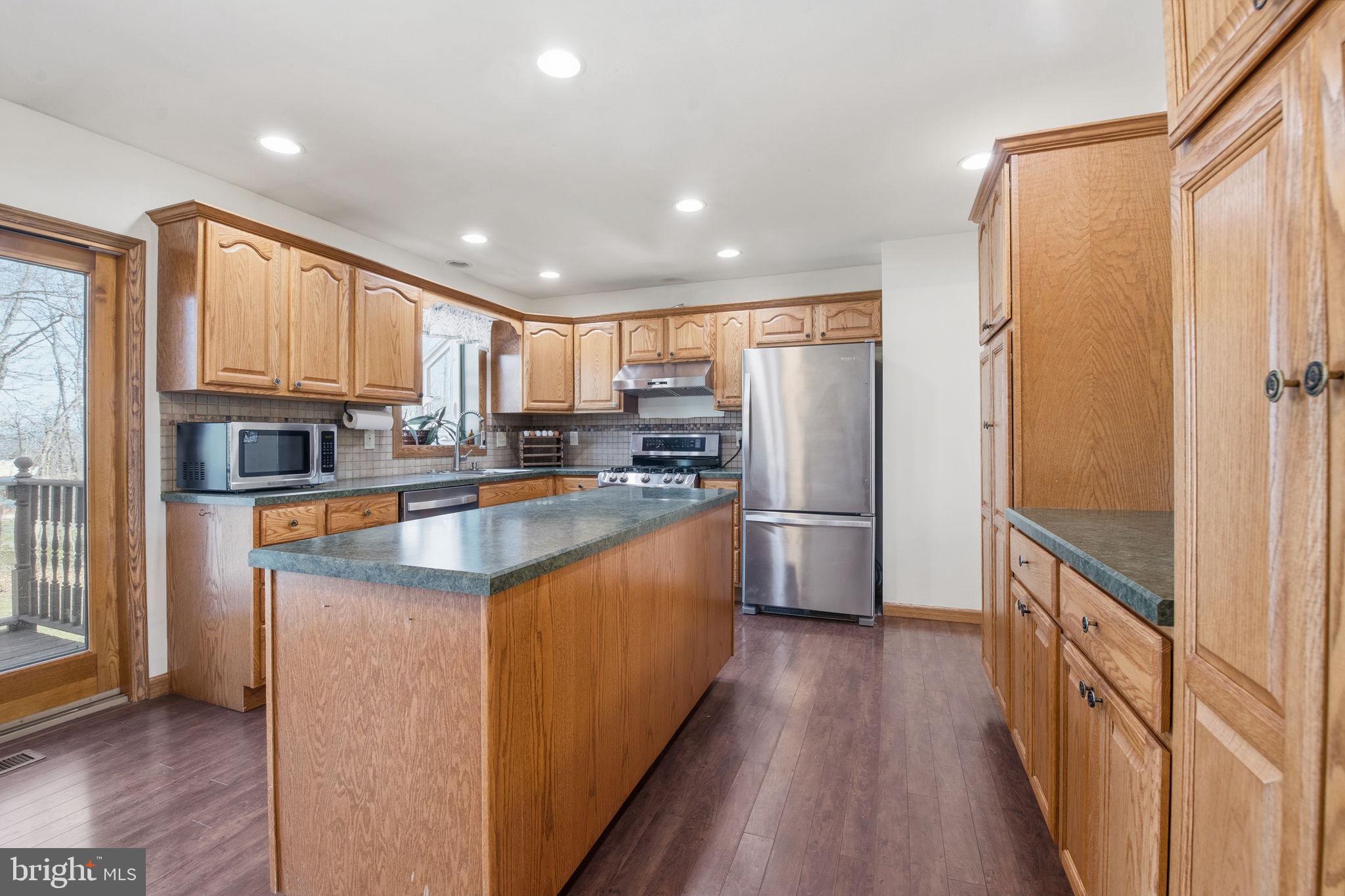 6501 Fair School Road Glen Rock, PA 17327 - Photo 6 of 43 a kitchen with stainless steel appliances granite countertop a refrigerator and a stove top oven