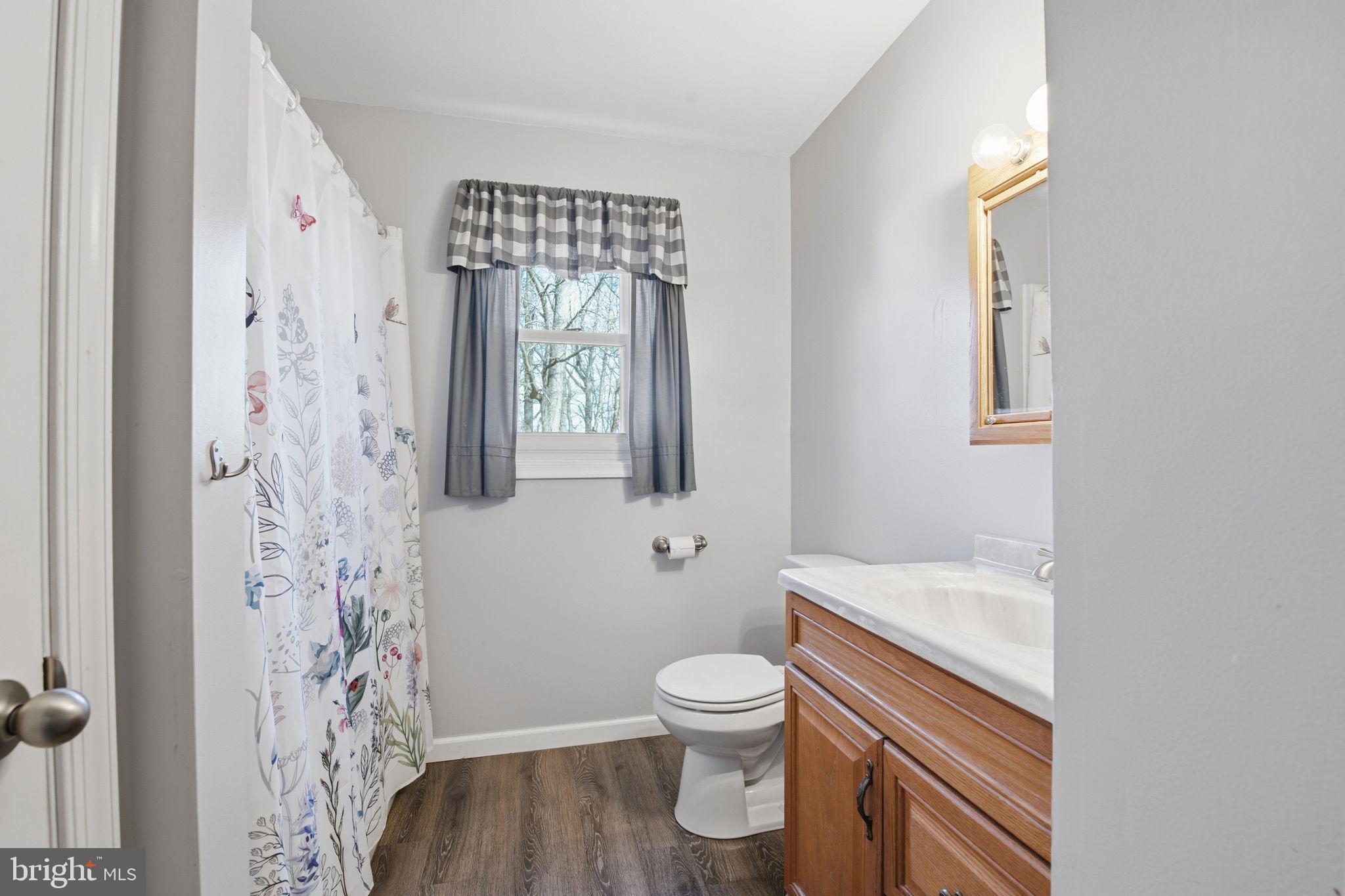 6501 Fair School Road Glen Rock, PA 17327 - Photo 9 of 43 a bathroom with a sink toilet and shower