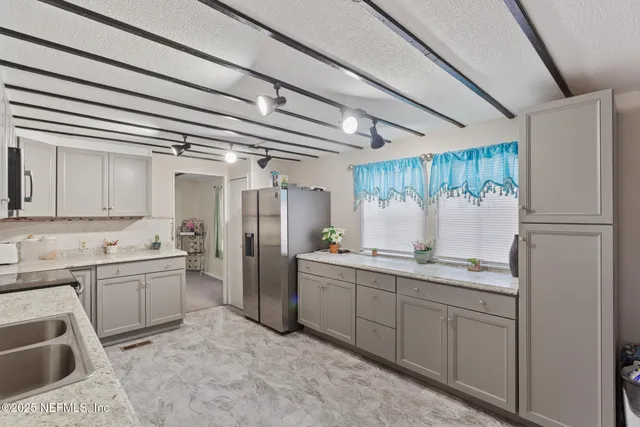 a bath room with a sink and a bath tub