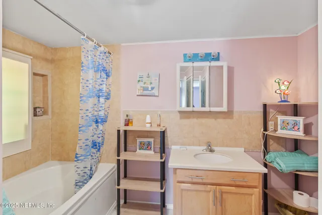 a view of a garage with a large tree