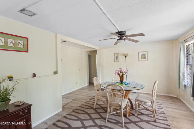 a view of a room with furniture and window