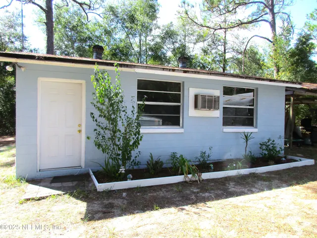 a view of a backyard with a lake and mountains