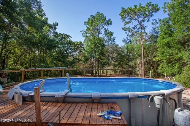 a view of swimming pool with a yard