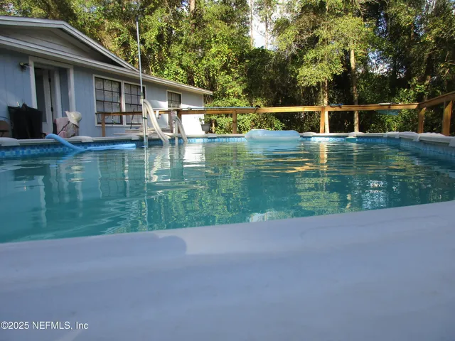 a backyard of a house with lots of green space