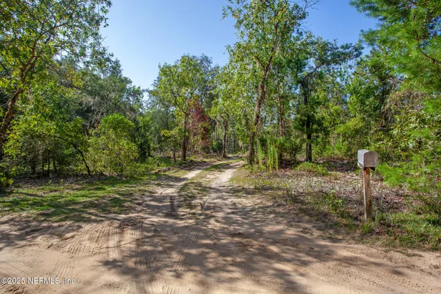 a kitchen with stainless steel appliances granite countertop a stove and a microwave