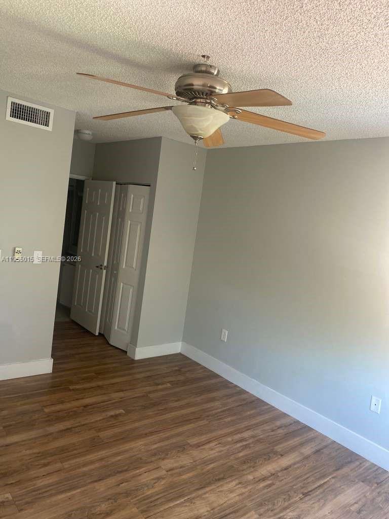 7930 North Nob Hill Road, Unit 304 Tamarac, FL 33321 - Photo 17 of 30 a view of a room with wooden floor