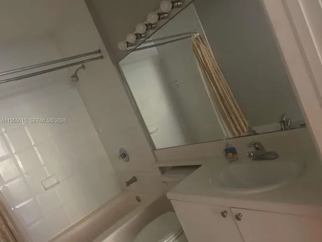 a bathroom with a sink and a shower