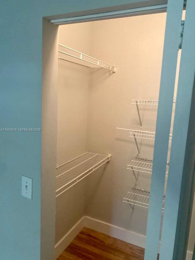 7930 North Nob Hill Road, Unit 304 Tamarac, FL 33321 - Photo 26 of 30 a view of small space with racks on the wall