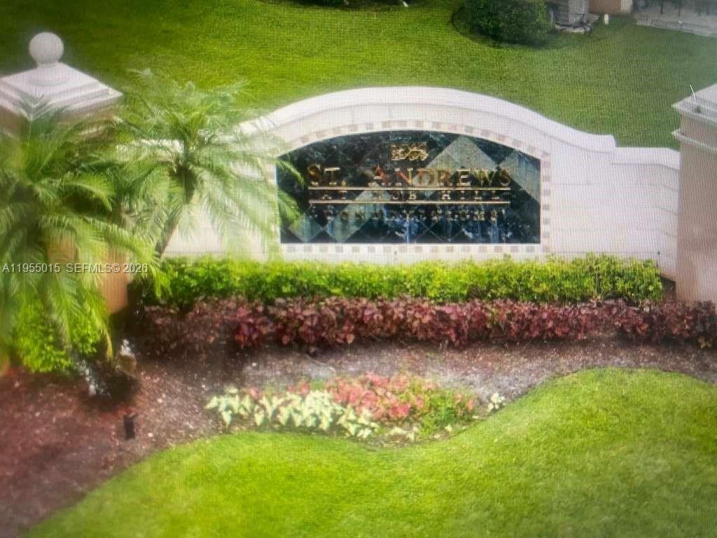 7930 North Nob Hill Road, Unit 304 Tamarac, FL 33321 - Photo 28 of 30 a view of a garden with a fountain